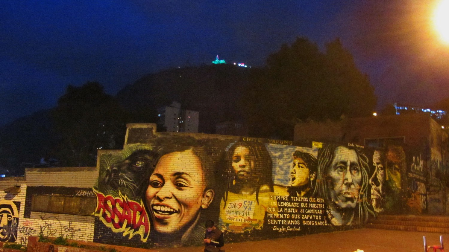 People on the wall with Cerro de Monserrate